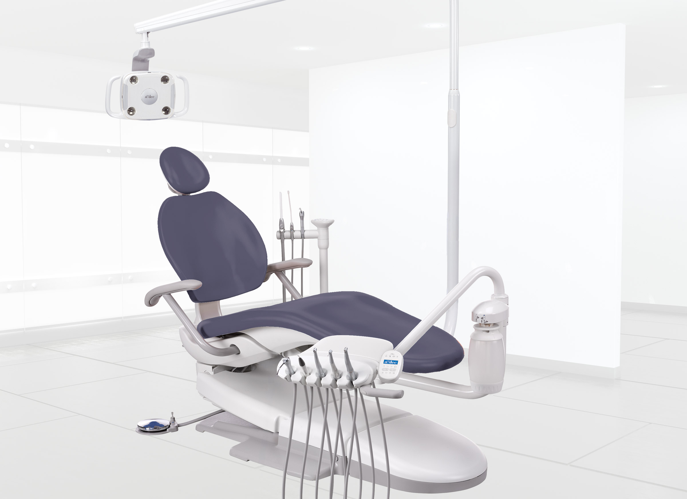 A-dec 300 dental chair package including dental light and delivery system in a brightly lit dental operatory